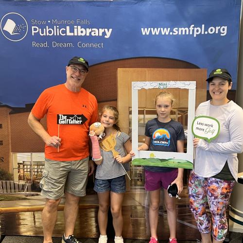 Tom and Madeline with Tom's granddaughters at the Stow Monroe Falls Library Foundation mini golf