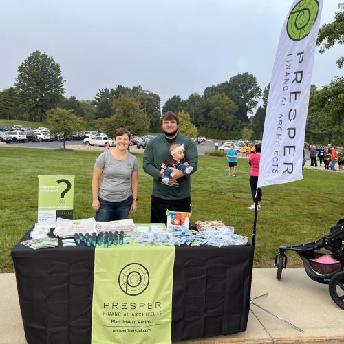 Madeline and Dan with Dan's daughter at the PFA table for The Oak Clinic's Acorn Run